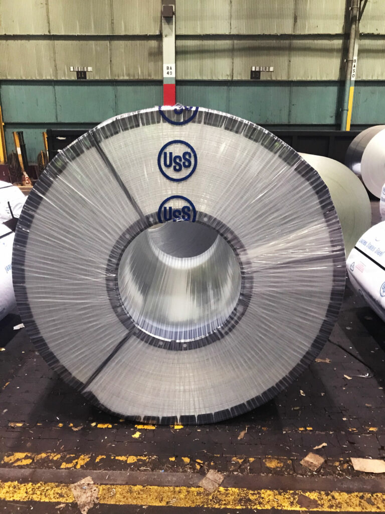 Coil wrapped using automated coil wrapping solution